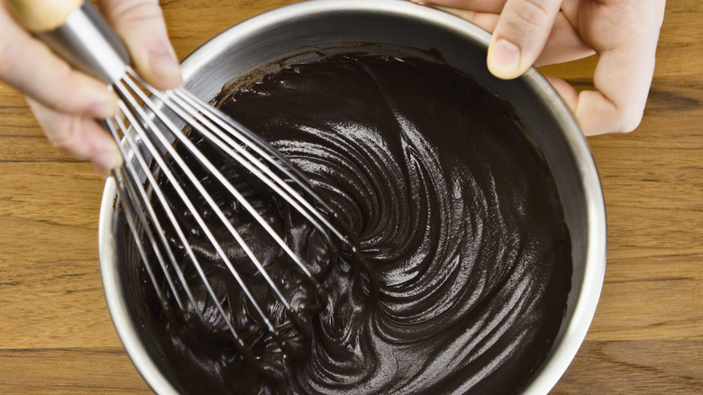 Whisking chocolate frosting