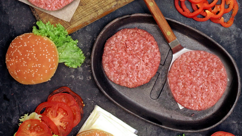 Burger patties in cast iron pan