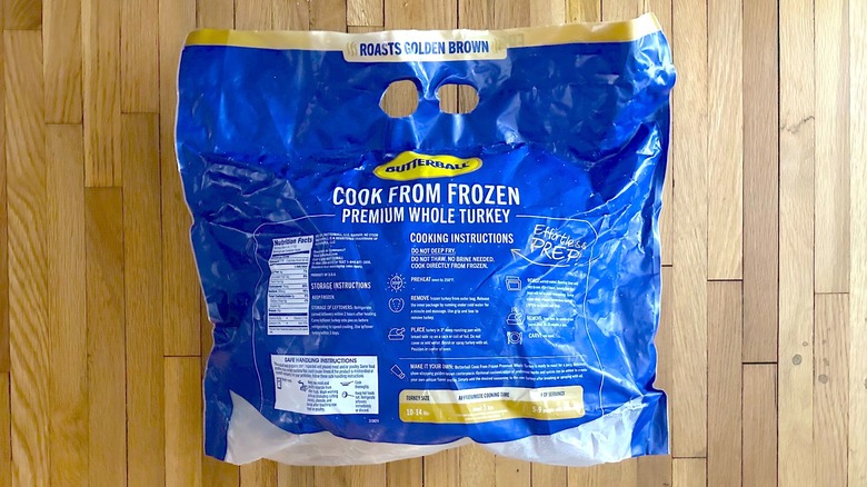 Back of package of Butterball's Cook from Frozen Premium Whole Turkey compare with a standard turkey