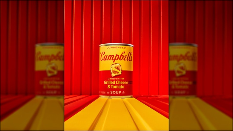 Can of Campbell's Grilled Cheese & Tomato Soup on a red and yellow background.