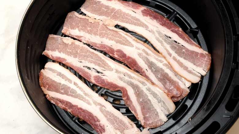 Uncooked bacon in air fryer