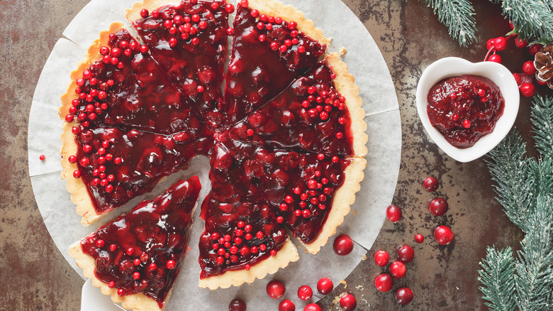 A pie made with jellied cranberries and topped with fresh cranberries