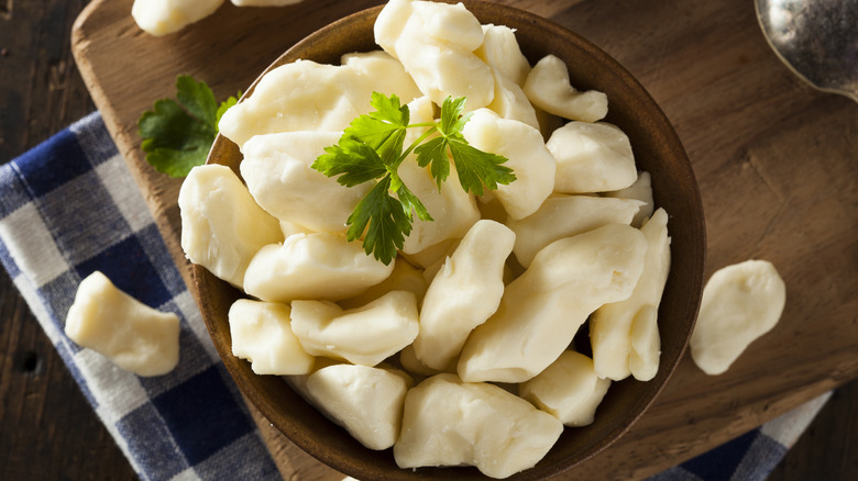 Cheese curds in a wooden bowl