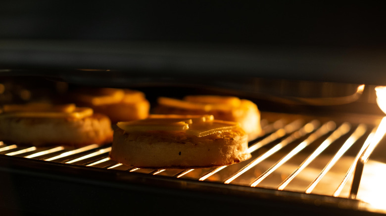 Crumpets with cheese in oven