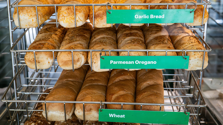 Shelves displaying Subway bread loaves