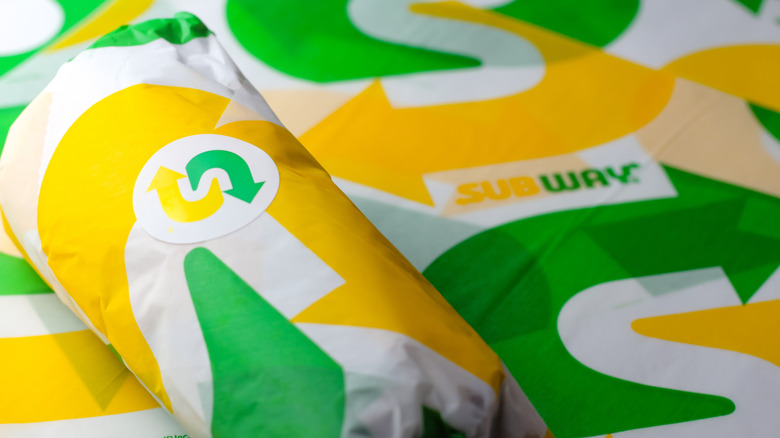 A wrapped Subway sandwich with logo printed on wrapper