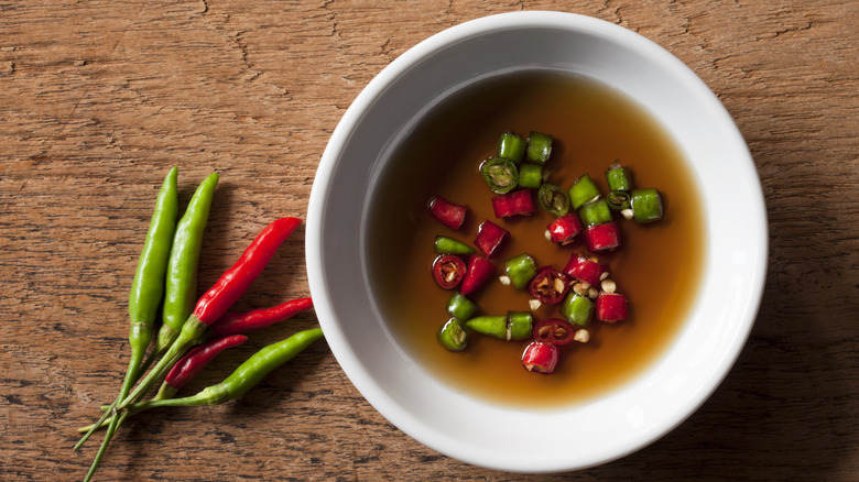 bowl of fish sauce with chili in it