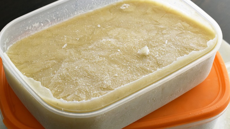 Plastic container of frozen gravy