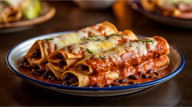 Plated enchiladas and beans