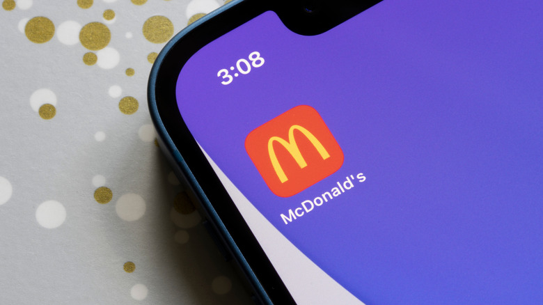 a purple phone screen with the McDonald's app