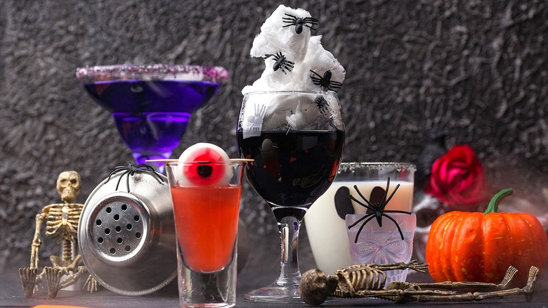 Purple, orange, black, and white Halloween-themed cocktails