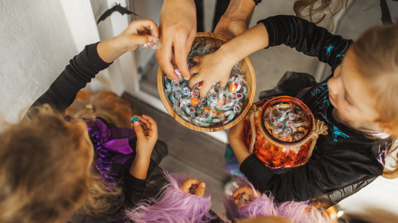 trick or treaters taking candy