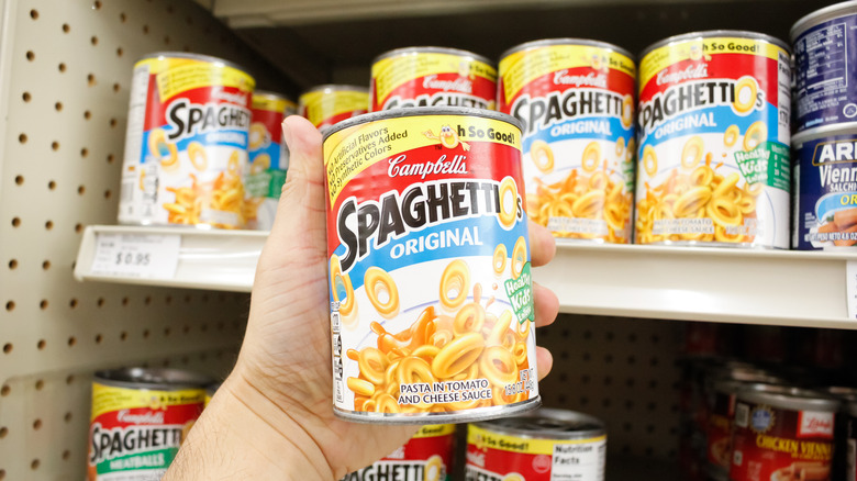 Person holding can of SpaghettiOs