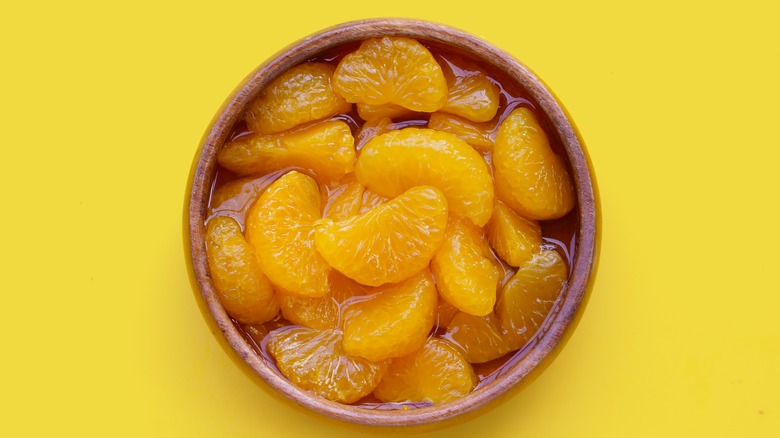 Wooden bowl of Mandarin oranges