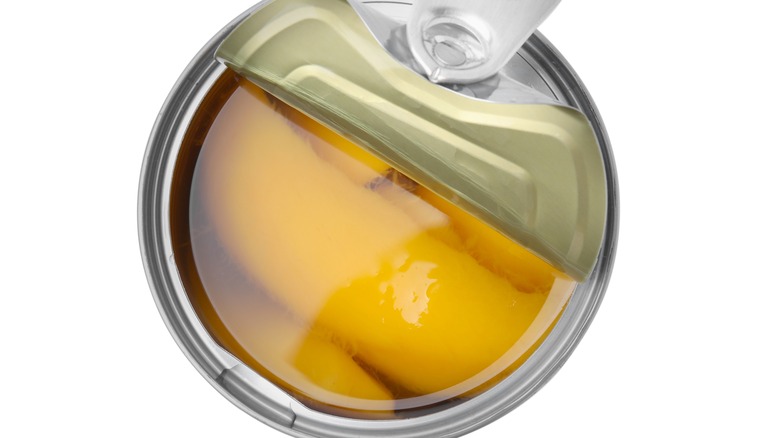 Opened can of sliced mango