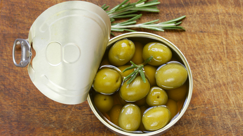 Opened can of green olives