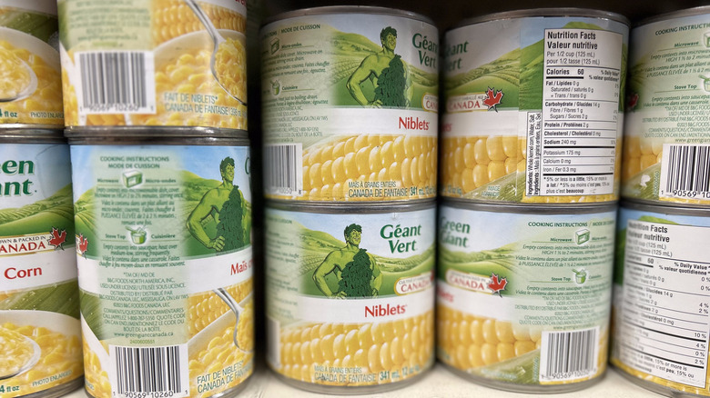 stacked cans of corn niblets