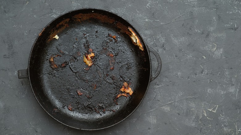 old cast iron pan with burnt bits