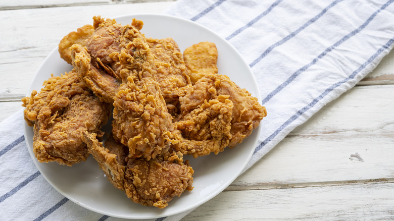 A plate of fried chicken on a table