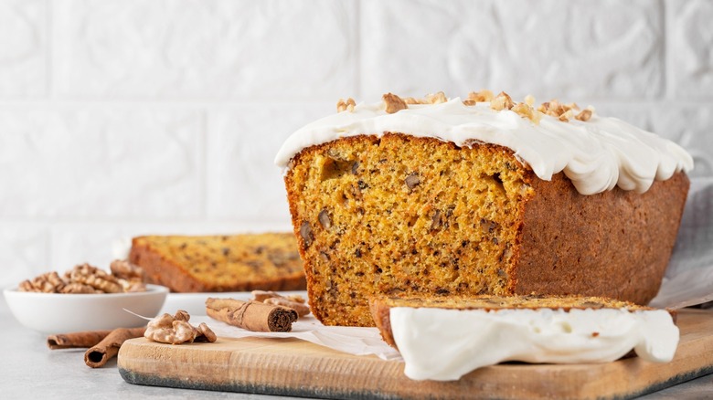 Carrot cake loaf with cinnamon sticks and walnuts