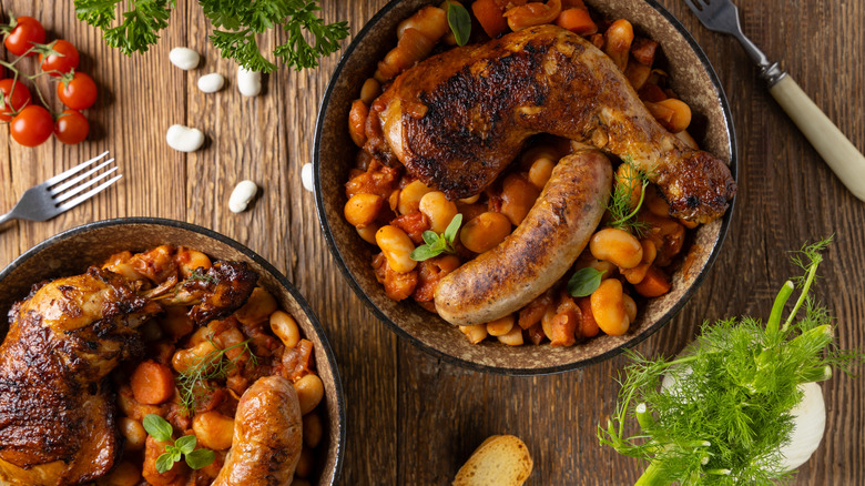 Two bowls of cassoulet with white beans and fresh herbs