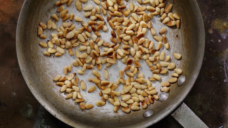 toasted pine nuts in pan