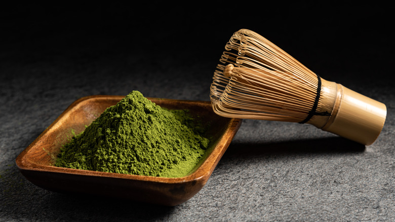 Loose matcha pictured with whisk