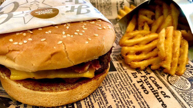 A Carl's Jr. burger with fries