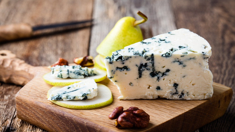 blocks of blue cheese with a spring of rosemary