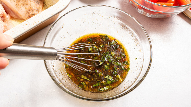 Whisking dressing with herbs