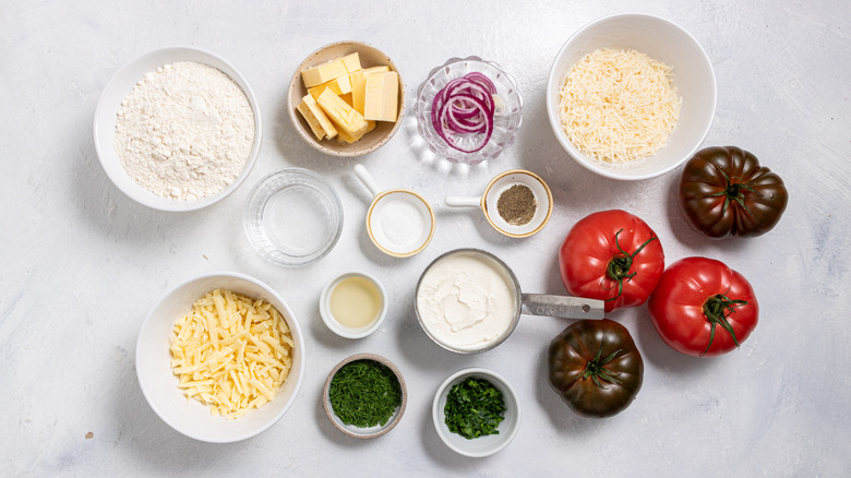 Ingredients for a cheesy roasted tomato pie recipe