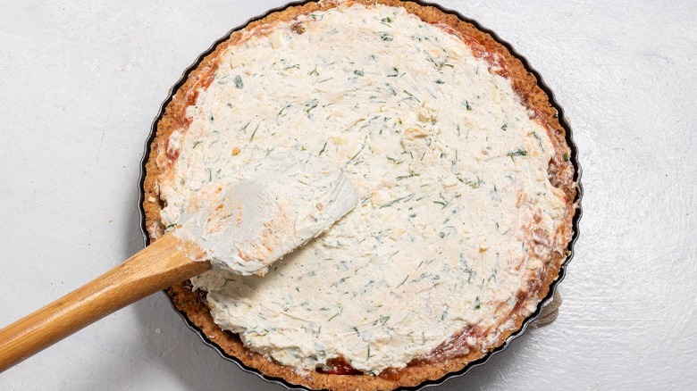 pie crust filled with herb cream cheese mixture