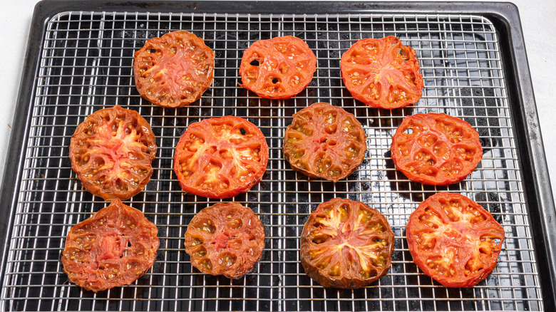 Roasted sliced tomatoes on a wired rack