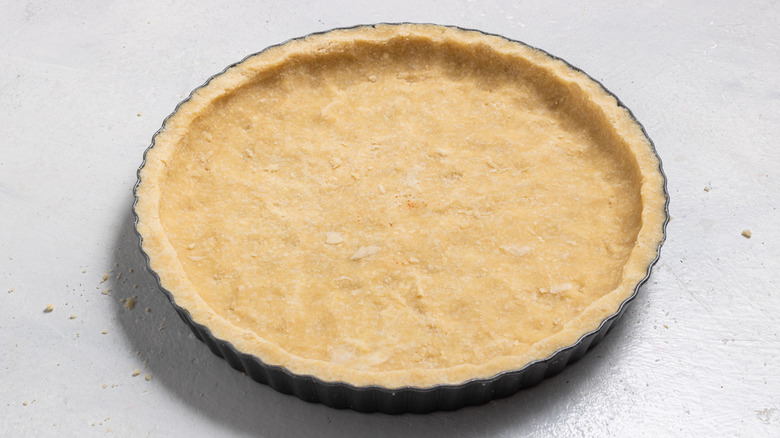 unbaked pie crust inside a pie dish