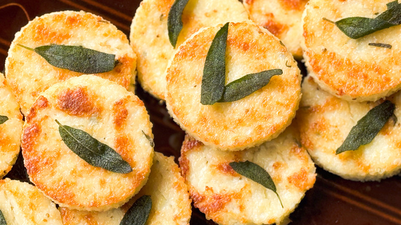 Cheesy truffled grit cakes with fried sage leaves