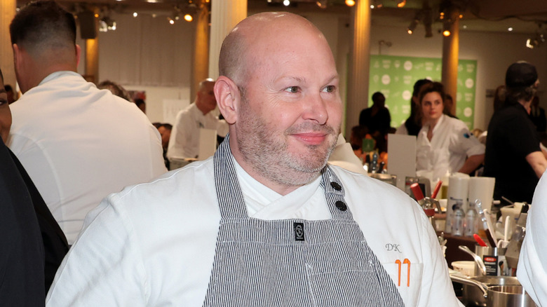 Chef Dan Kluger smirking at an event