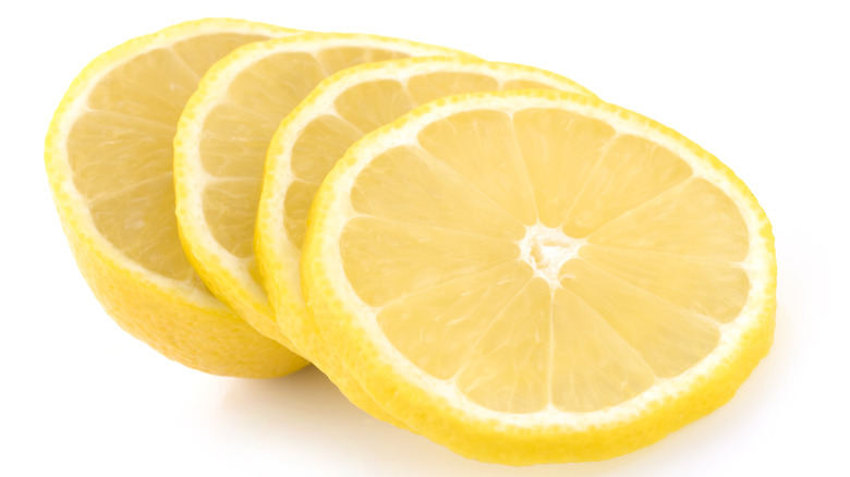 sliced lemon on white background
