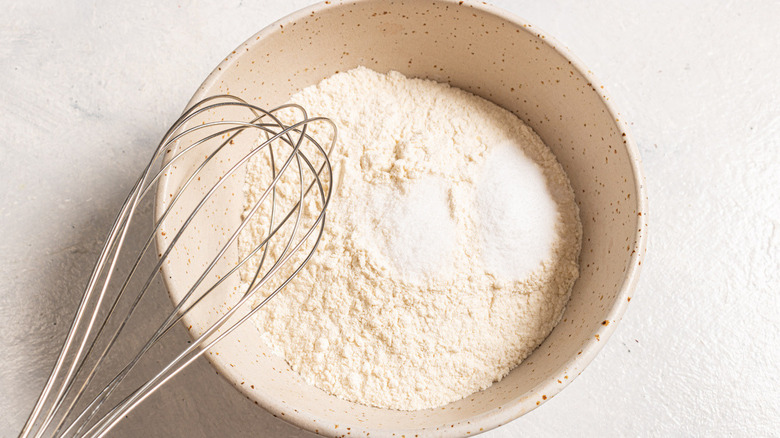 whisk and flour in bowl