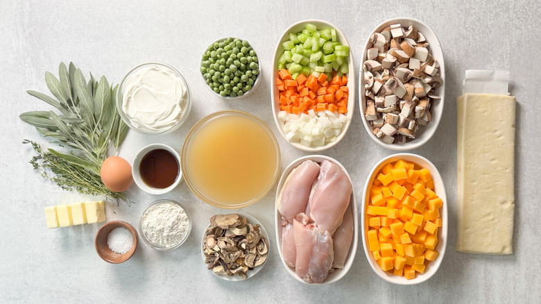 Chicken, mushroom, and winter squash pot pie ingredients on countertop