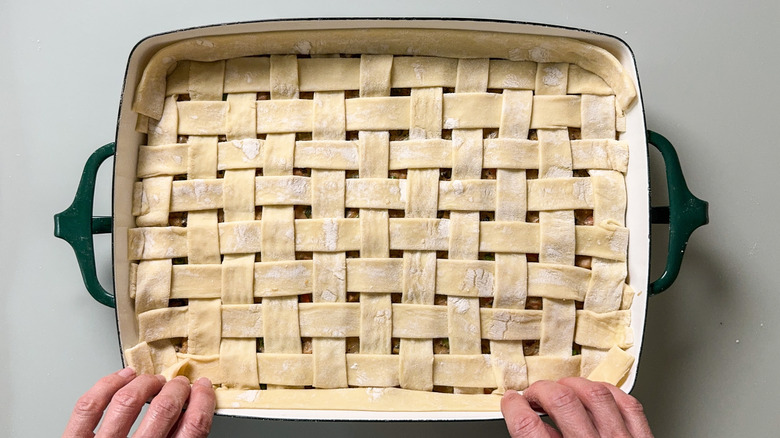 Puff pastry dough lattice crust on pot pie in casserole dish