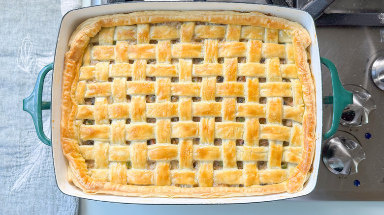 Chicken, mushroom, and winter squash pot pie baked in rectangular casserole dish on stovetop