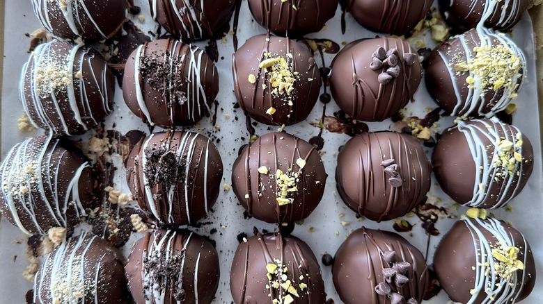chocolate covered ice cream balls in pan