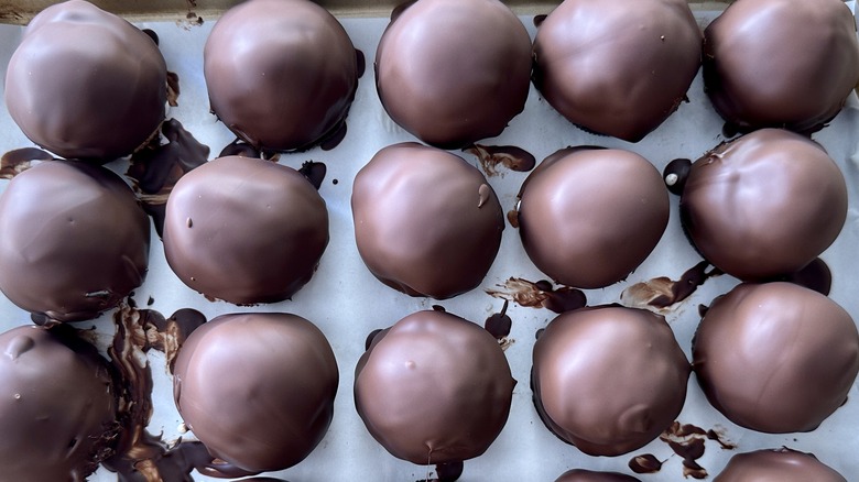 chocolate covered ice cream balls in pan