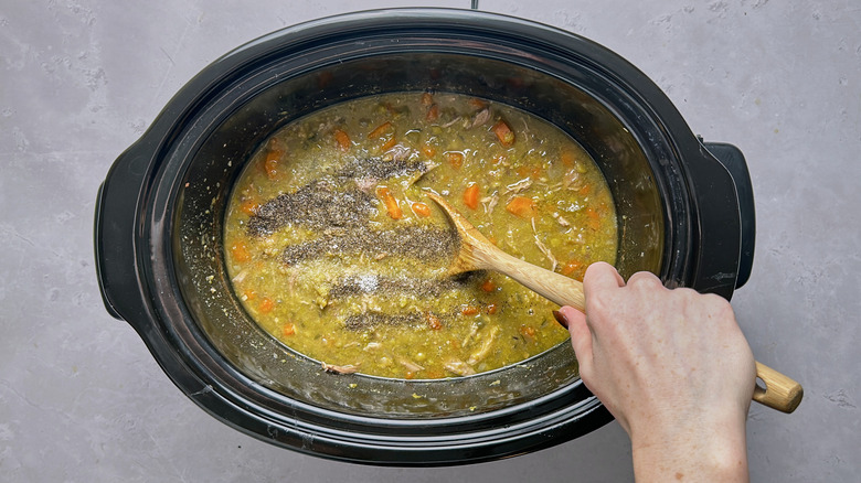 stirring seasonings into soup