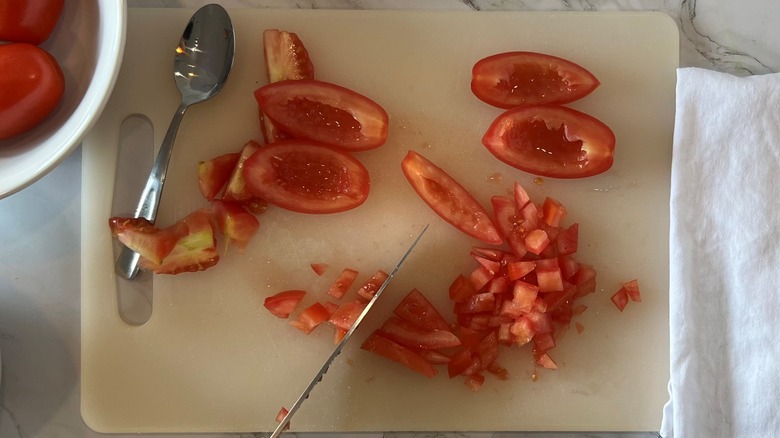 chopped tomatoes with knife