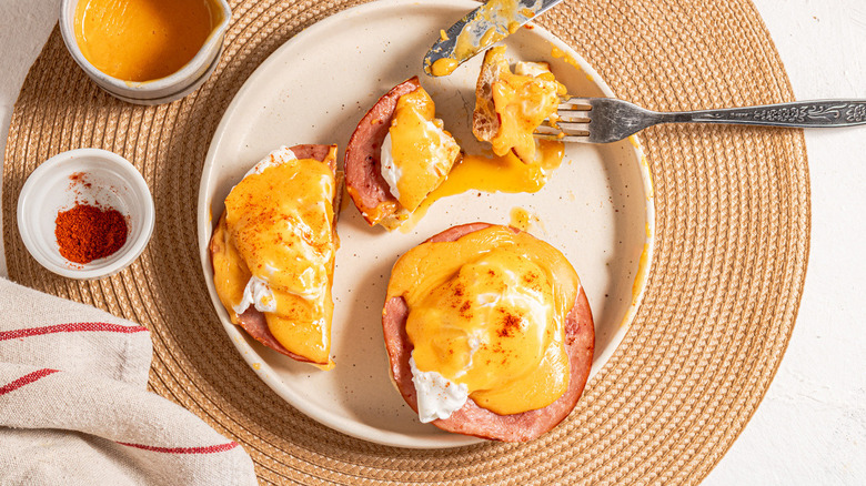 eggs Benedict on white plate