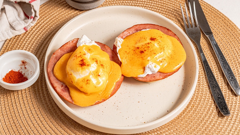 eggs Benedict on white plate