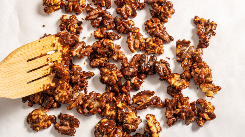 Caramelized walnuts on a parchment paper