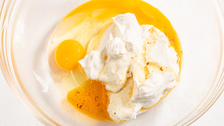 Bowl with sour cream, egg, and vanilla