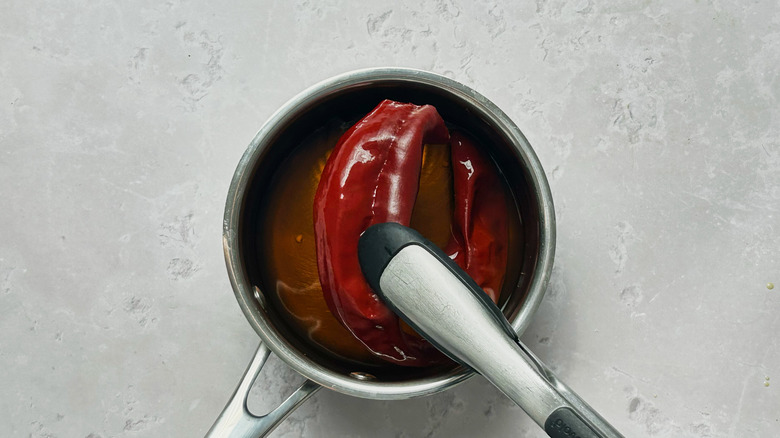 softened chile in saucepan